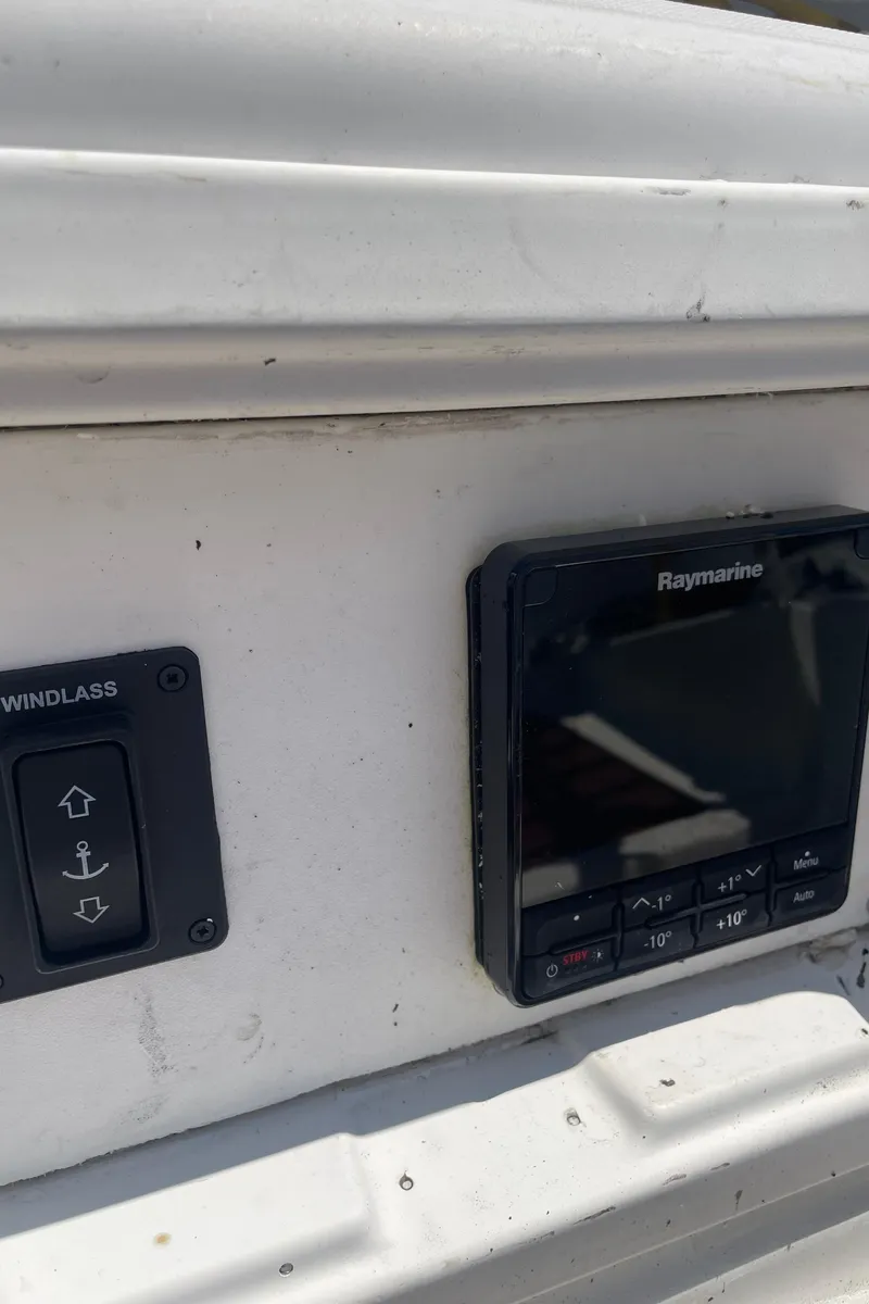 Slide: The Image of Control panel on a 1990 Jeanneau Sun Odyssey 36 sailboat, featuring Raymarine equipment. - 23