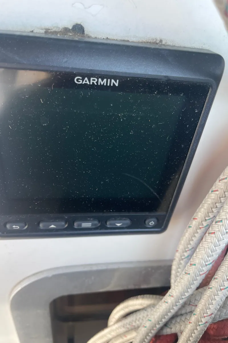 Slide: The Image of Garmin navigation device on Jeanneau Sun Odyssey 36, 1990 model, with ropes nearby. - 24