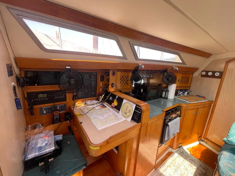 Slide: The Image of Interior of 1990 Jeanneau Sun Odyssey 36 sailboat with navigation station and galley. - 28