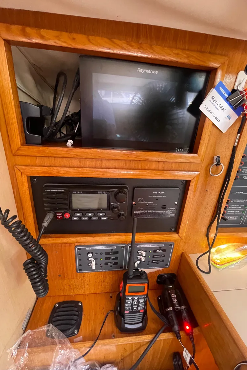 Slide: The Image of Navigation equipment on a 1990 Jeanneau Sun Odyssey 36 sailboat, featuring Raymarine electronics. - 29