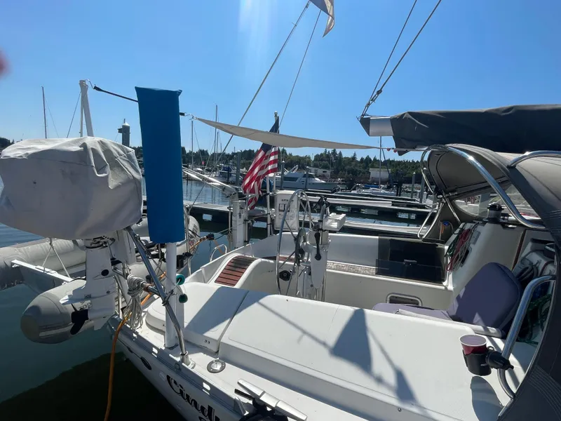 Slide: The Image of Jeanneau Sun Odyssey 36 sailboat docked at marina, 1990 model, sunny day. - 4