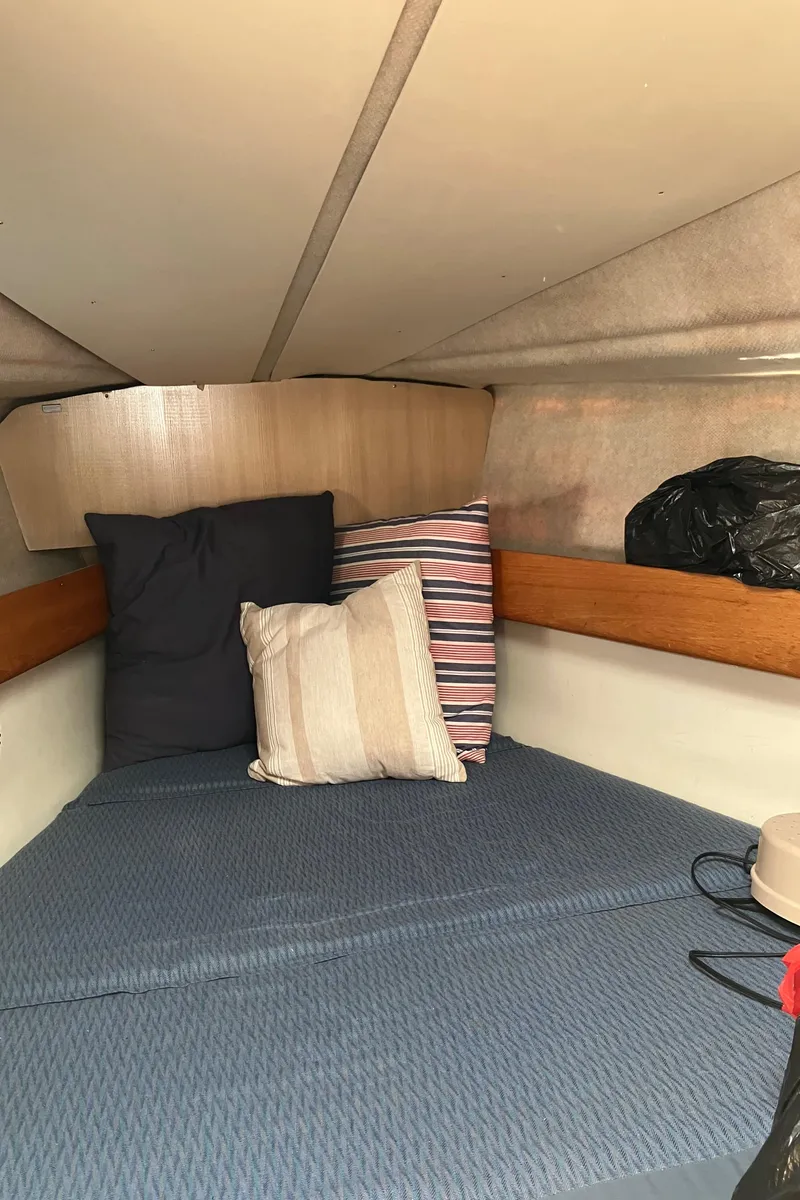 Slide: The Image of Cozy cabin interior of 1990 Jeanneau Sun Odyssey 36 sailboat with cushions and bedding. - 41