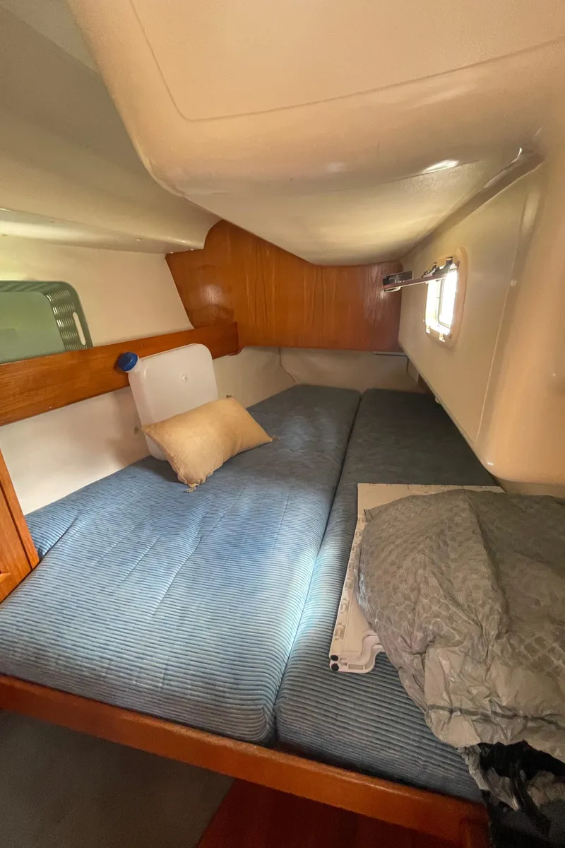 Slide: The Image of Cozy cabin interior of 1990 Jeanneau Sun Odyssey 36 sailboat with comfortable bedding. - 42