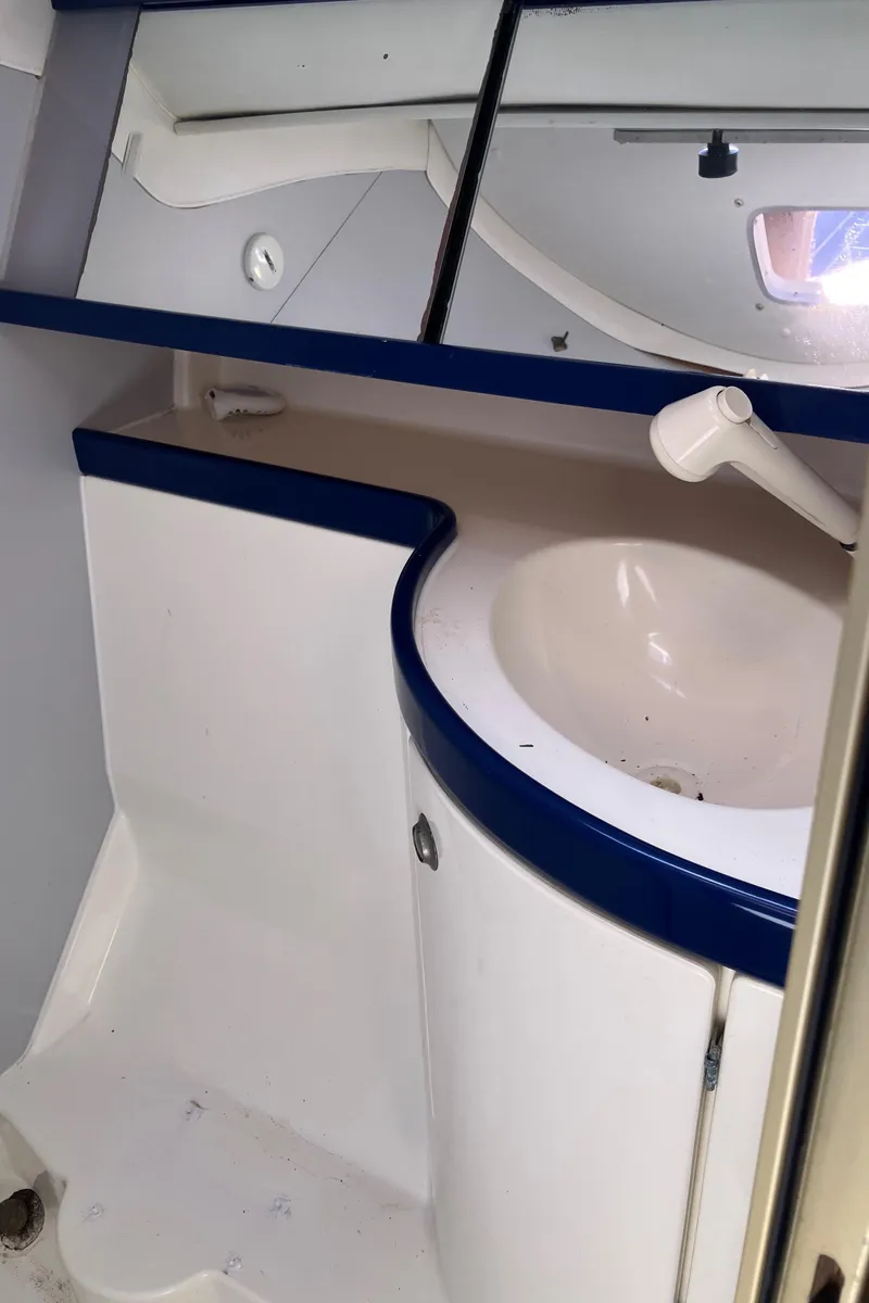 Slide: The Image of Interior of 1990 Jeanneau Sun Odyssey 36 sailboat bathroom with sink and mirror. - 43