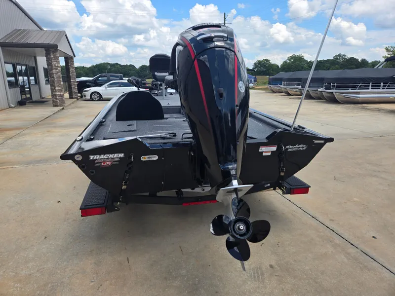 Slide: The Image of 2019 Tracker Pro Team 190 TX Tournament Edition boat with outboard motor, parked outdoors. - 4