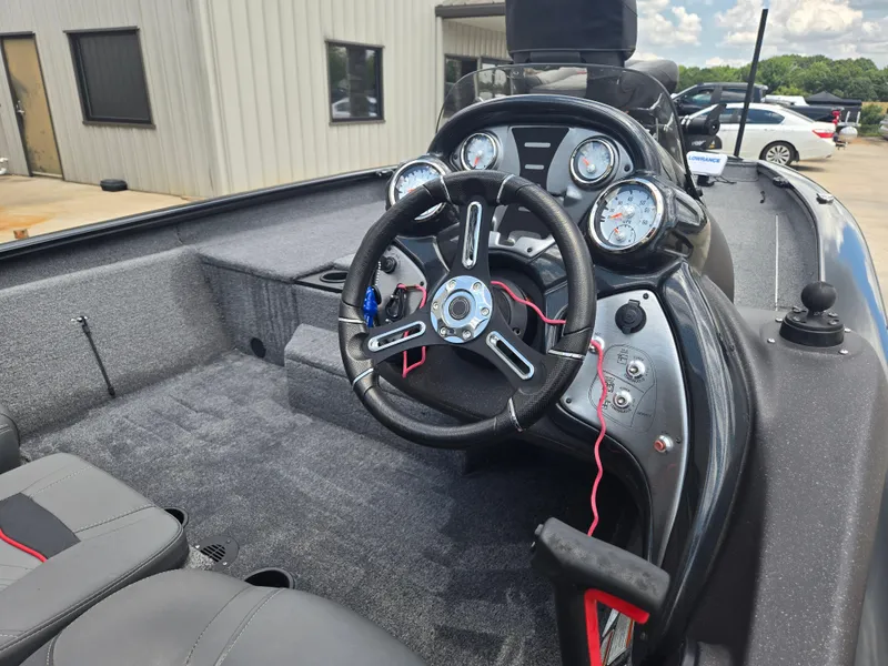 Slide: The Image of 2019 Tracker Pro Team 190 TX Tournament Edition boat interior with steering wheel and gauges. - 5