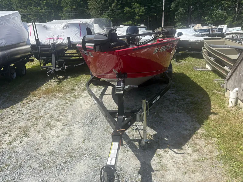 Slide: The Image of 2016 Tracker Pro Guide V-175 SC boat on trailer, parked outdoors. - 4