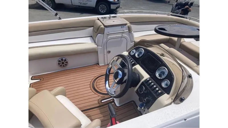 Slide: The Image of 2019 Starcraft MDX 191 O/B boat interior with steering wheel and seating. - 3