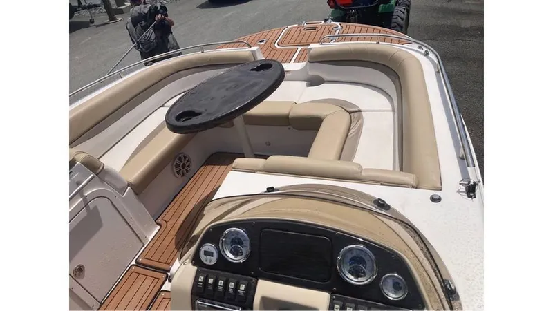 Slide: The Image of 2019 Starcraft MDX 191 O/B boat interior with beige seating and dashboard. - 6