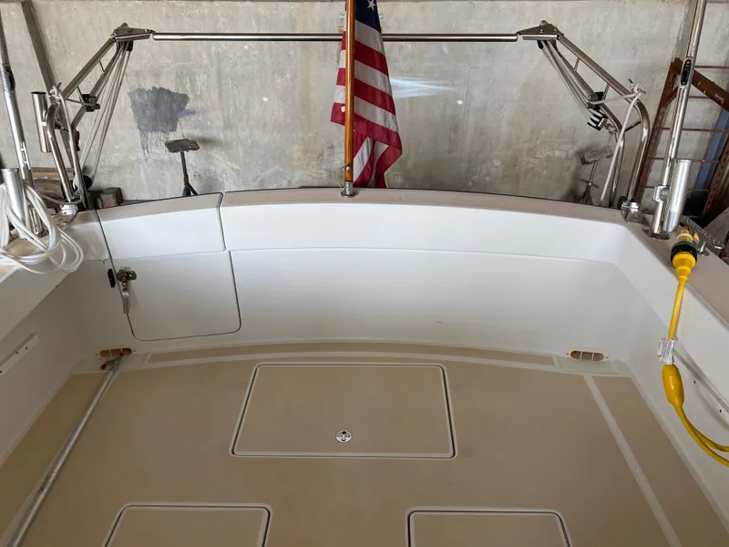 Slide: The Image of 2005 MJM 34z Downeast boat deck with American flag and stainless steel fittings. - 10