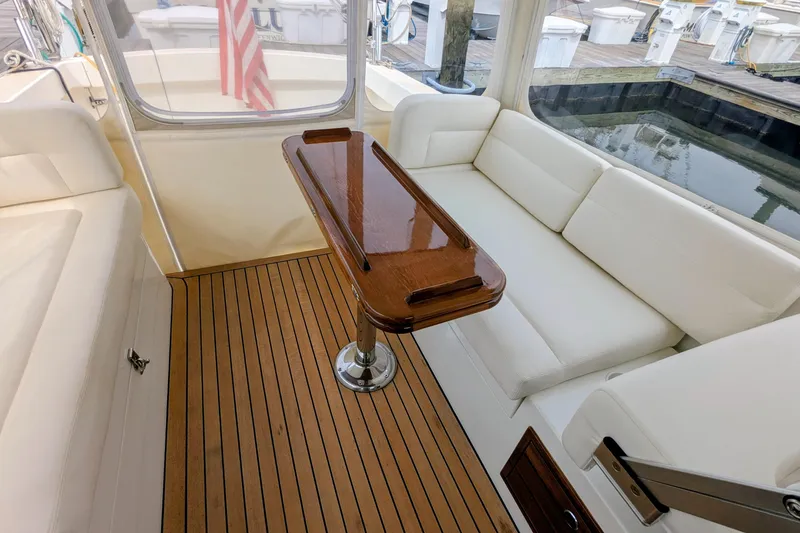Slide: The Image of Luxurious 2005 MJM 34z Downeast yacht interior with elegant seating and polished wood table. - 16