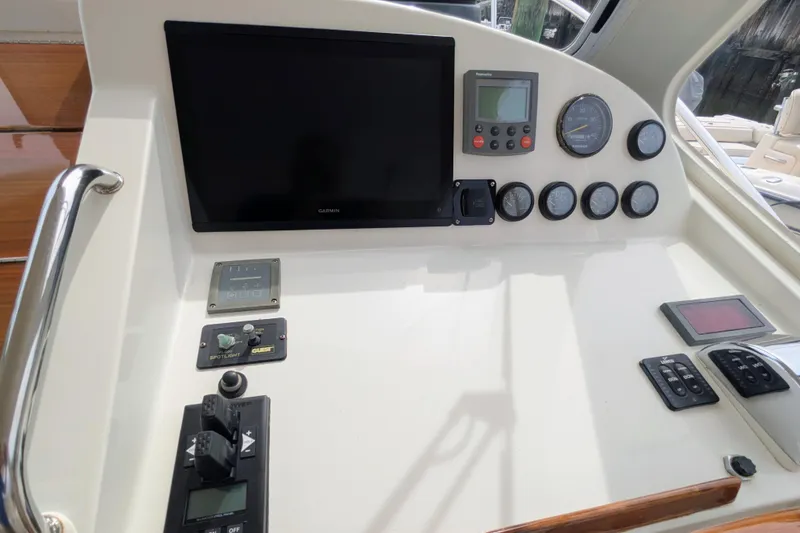 Slide: The Image of Control panel of a 2005 MJM 34z Downeast boat with gauges and navigation equipment. - 19