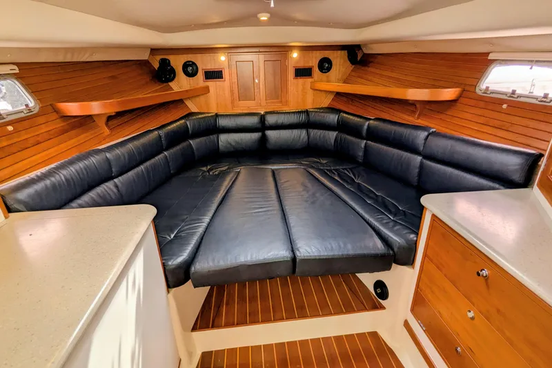 Slide: The Image of Luxurious interior of 2005 MJM 34z Downeast boat with leather seating and wooden accents. - 22