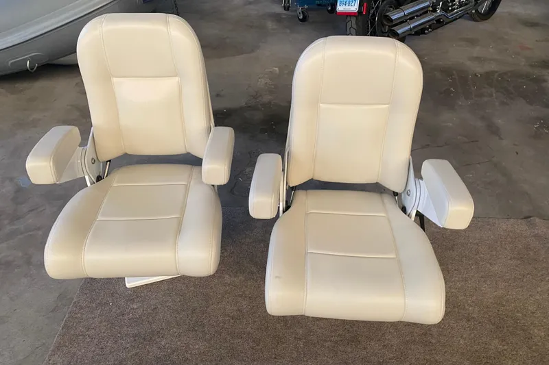 Slide: The Image of Two beige boat seats from a 2005 MJM 34z Downeast model. - 29