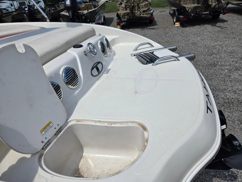 Slide: The Image of 2014 Tahoe Q5i boat interior with seating and storage compartments. - 15