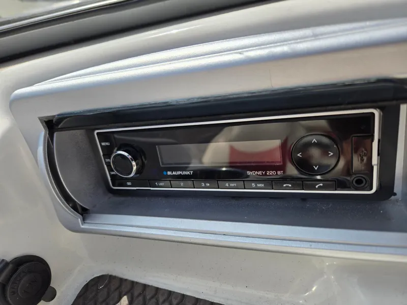 Slide: The Image of Blaupunkt Sydney 220 BT stereo in 2014 Tahoe Q5i boat dashboard. - 7