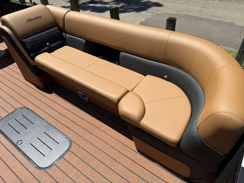 Slide: The Image of 2026 Bentley Pontoons Elite 253 Admiral with luxurious tan seating and sleek design. - 11