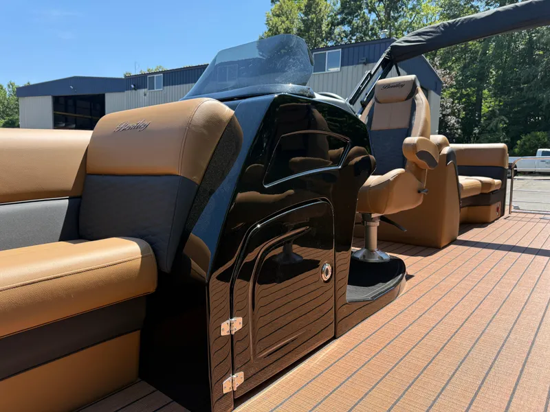 Slide: The Image of 2026 Bentley Pontoons Elite 253 Admiral interior with luxurious seating and sleek design. - 13