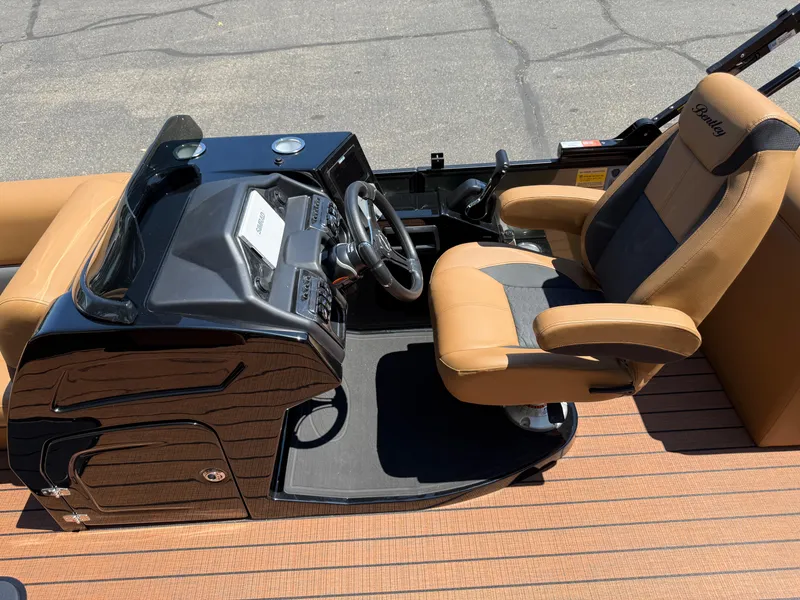 Slide: The Image of 2026 Bentley Pontoons Elite 253 Admiral helm with tan and black seating. - 21