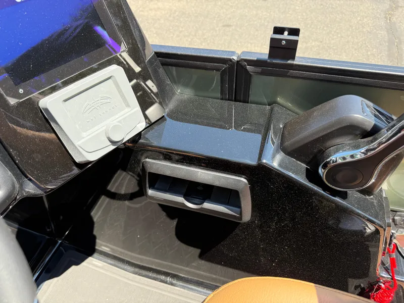 Slide: The Image of 2026 Bentley Pontoons Elite 253 Admiral dashboard with control panel and throttle lever. - 24