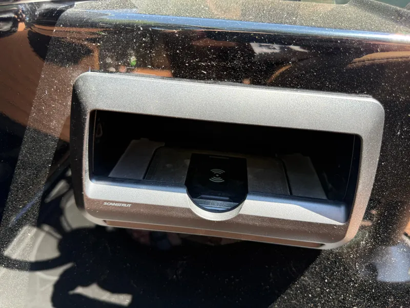 Slide: The Image of Charging port on 2026 Bentley Pontoons Elite 253 Admiral, featuring a sleek black design. - 25