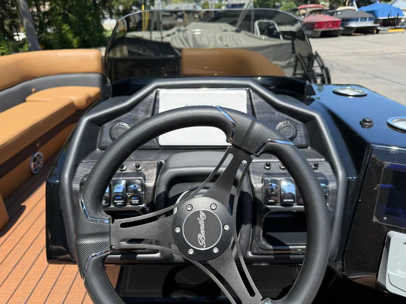 Slide: The Image of Steering wheel and dashboard of 2026 Bentley Pontoons Elite 253 Admiral boat. - 26