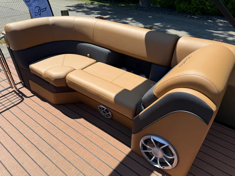 Slide: The Image of Luxurious seating on 2026 Bentley Pontoons Elite 253 Admiral with tan upholstery and integrated speaker. - 31