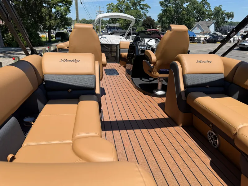 Slide: The Image of Luxurious interior of 2026 Bentley Pontoons Elite 253 Admiral with tan leather seating. - 37