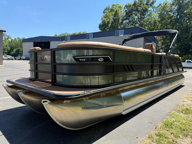 Slide: The Image of 2026 Bentley Pontoons Elite 253 Admiral on display outdoors, showcasing sleek design and luxury features. - 4
