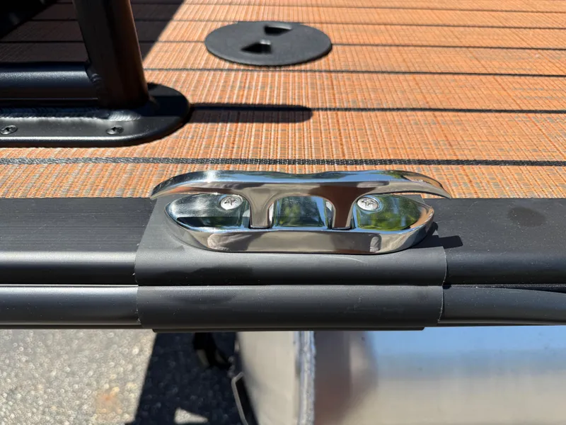 Slide: The Image of 2026 Bentley Pontoons Elite 253 Admiral deck with chrome cleat and textured flooring. - 8