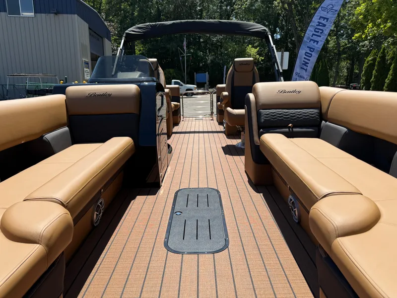 Slide: The Image of 2026 Bentley Pontoons Elite 253 Admiral with luxurious tan seating and sleek design. - 9