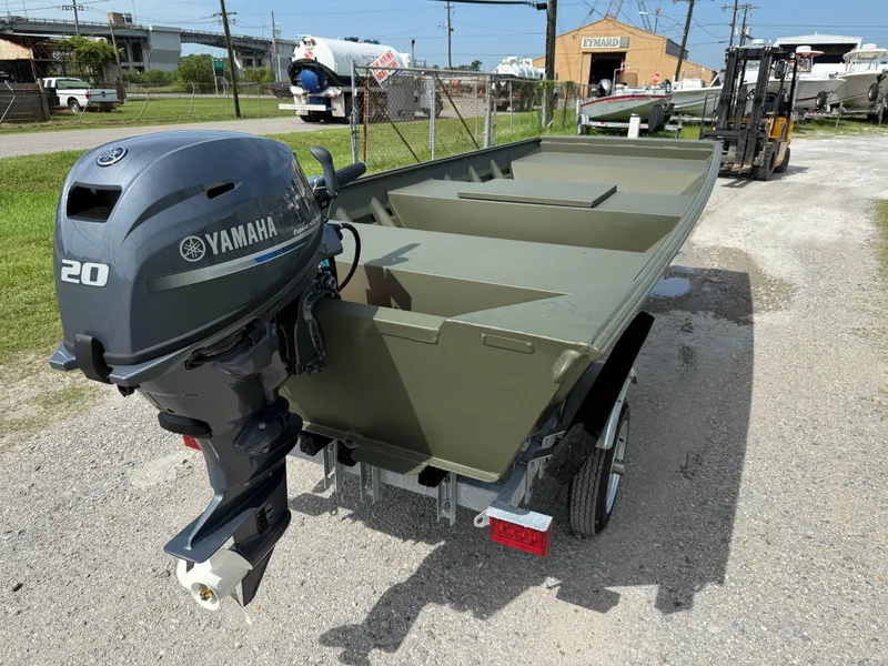Slide: The Image of 2025 Alweld 1442 Marsh Jon boat with Yamaha 20HP outboard motor on trailer. - 2