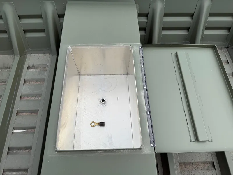 Slide: The Image of 2025 Alweld 1442 MARSH JON DSLW boat storage compartment with open lid and key inside. - 4