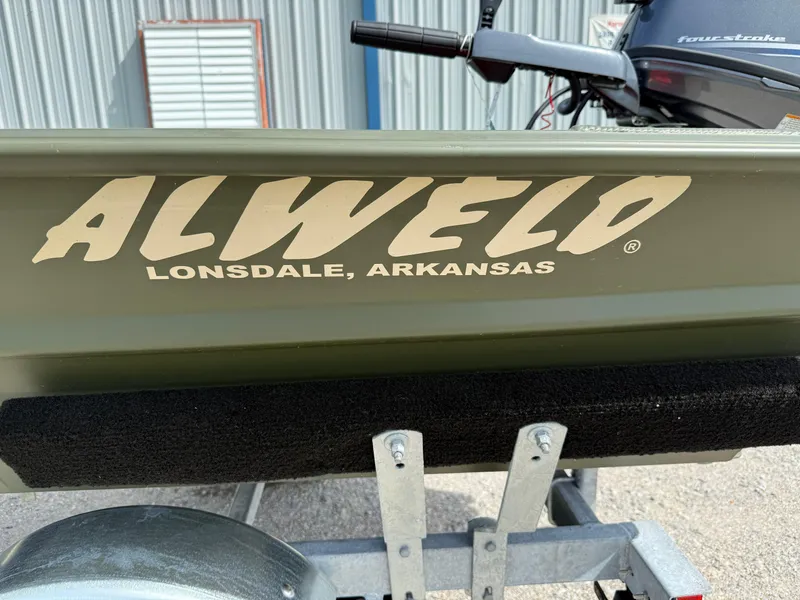 Slide: The Image of 2025 Alweld 1442 Marsh Jon boat, Lonsdale, Arkansas branding, on trailer. - 9
