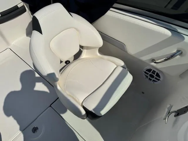 Slide: The Image of 2024 Robalo R207 Dual Console boat seat, white upholstery, modern design. - 17