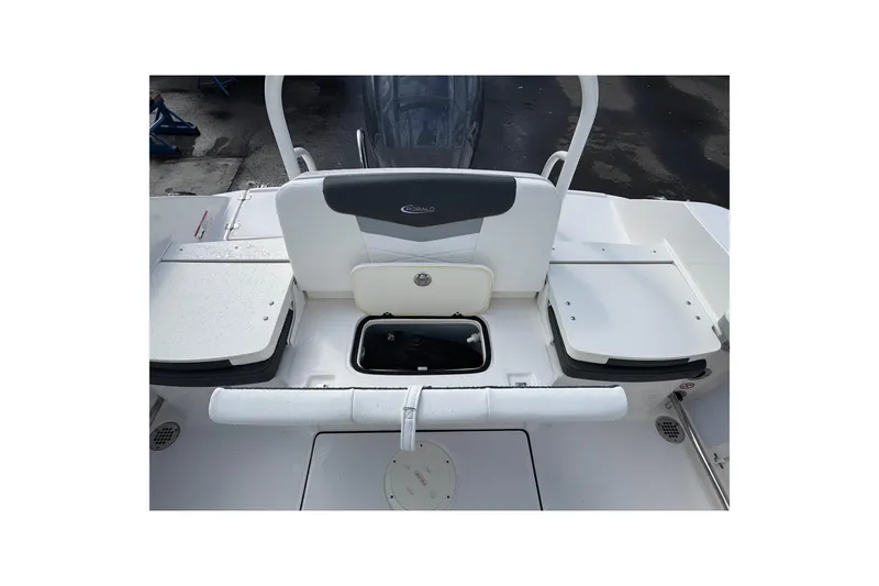Slide: The Image of 2024 Robalo R207 Dual Console boat interior with storage compartments and seating. - 30