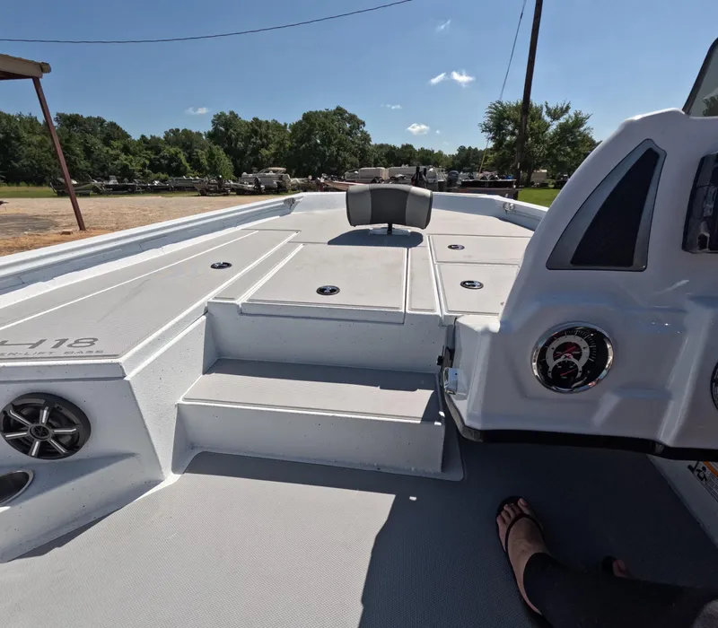 Slide: The Image of 2026 Xpress H 18 BASS boat interior with seating and storage compartments. - 3