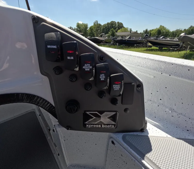 Slide: The Image of Control panel of 2026 Xpress H 18 BASS boat with labeled switches. - 6