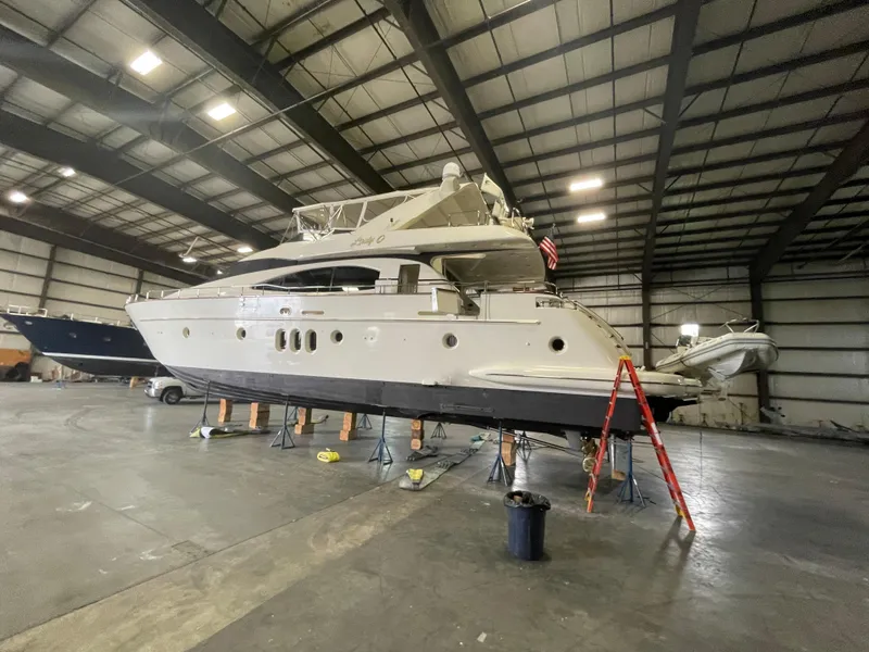 Slide: The Image of 2004 Azimut 74 yacht in a spacious indoor storage facility. - 11