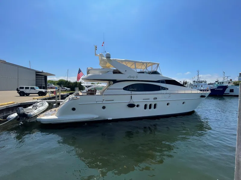 Slide: The Image of 2004 Azimut 74 yacht docked in sunny marina, side view. - 2