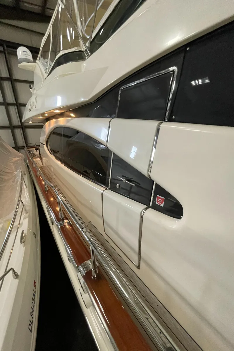 Slide: The Image of 2004 Azimut 74 yacht side view in a marina. - 30