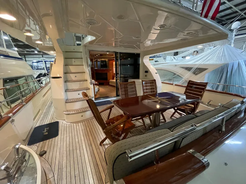 Slide: The Image of Luxurious 2004 Azimut 74 yacht deck with elegant seating and dining area. - 35