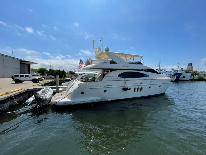 Slide: The Image of 2004 Azimut 74 yacht docked at marina under clear blue sky. - 4