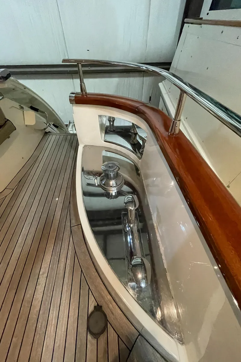 Slide: The Image of 2004 Azimut 74 yacht deck with polished wood and stainless steel details. - 41