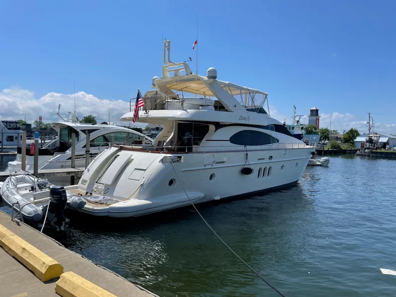 Slide: The Image of Luxury 2004 Azimut 74 yacht docked in sunny marina. - 5