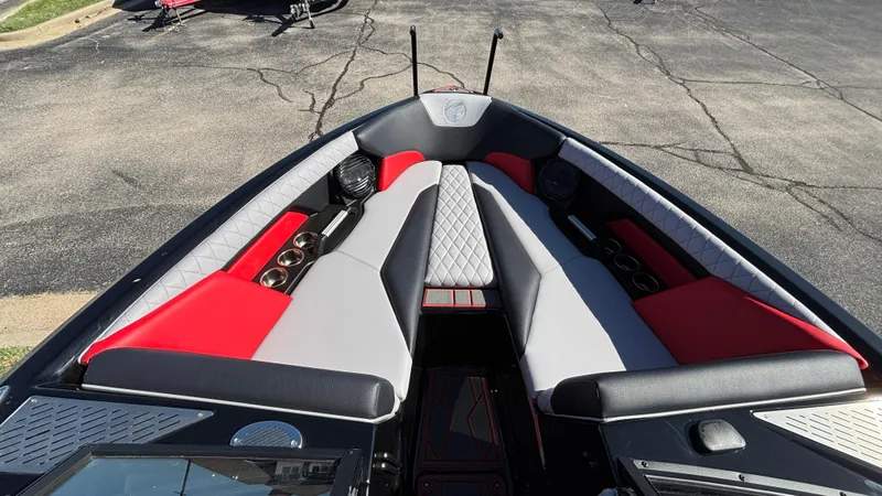 Slide: The Image of 2026 Tigé Z5 boat interior with red and gray seating, cup holders, and speakers. - 14