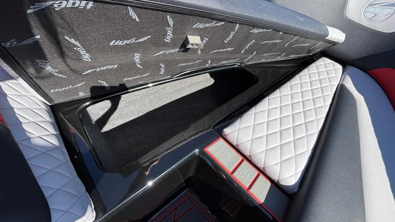 Slide: The Image of 2026 Tigé Z5 interior with quilted seats and storage compartment. - 17