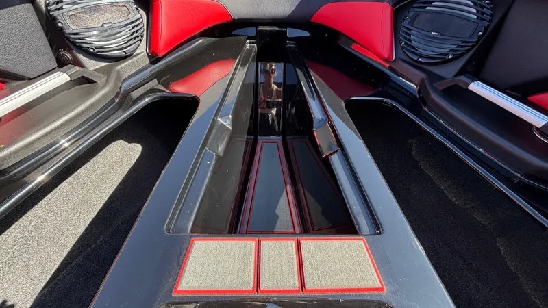 Slide: The Image of 2026 Tigé Z5 boat interior with sleek black and red design, featuring modern speakers. - 20