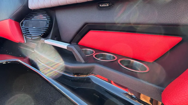 Slide: The Image of 2026 Tigé Z5 interior with red accents, cup holders, and speaker detail. - 21