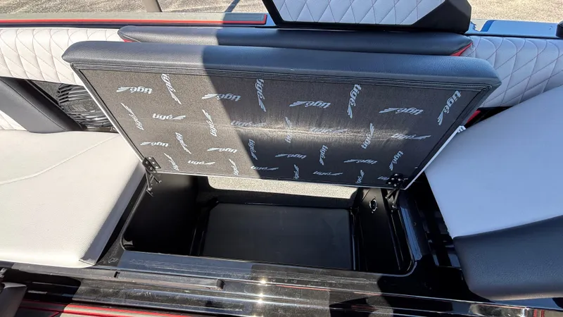 Slide: The Image of 2026 Tigé Z5 boat storage compartment with open seat, showcasing interior design. - 26